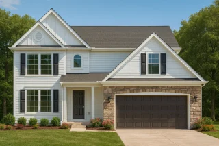 Front view of a Traditional Colonial style house featuring white horizontal siding, board and batten gables, and stone accents with dark shutters and a two-car garage