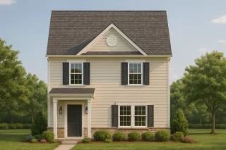 Front elevation of a Colonial Revival style home featuring light siding, black shutters, and a stone-accented foundation beneath a steep gable roof.