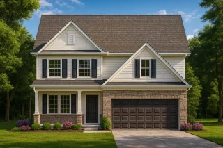Front view of a two-story Traditional Colonial home featuring horizontal siding, stone veneer, and a front-entry two-car garage