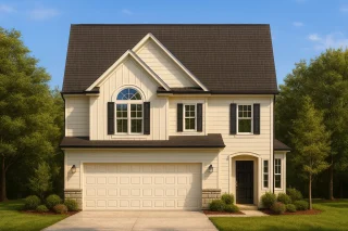 Front view of a Traditional Colonial style home with horizontal siding, partial stone accents, and symmetrical windows under a gable roof